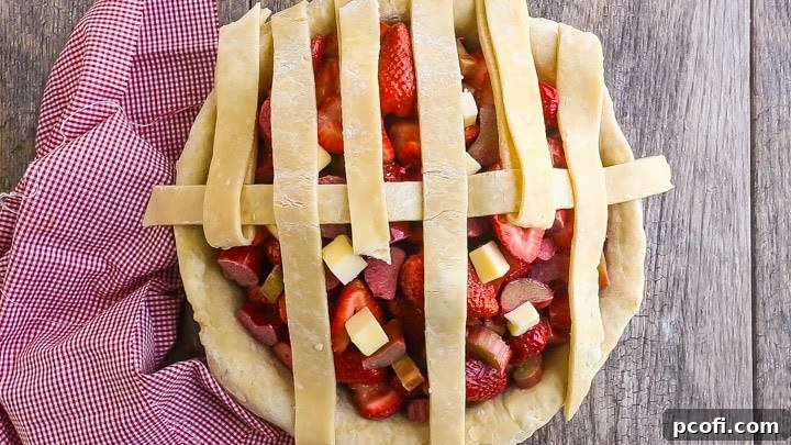 How to Make Lattice Pie Crust Step-by-Step: Folding up other vertical strips.