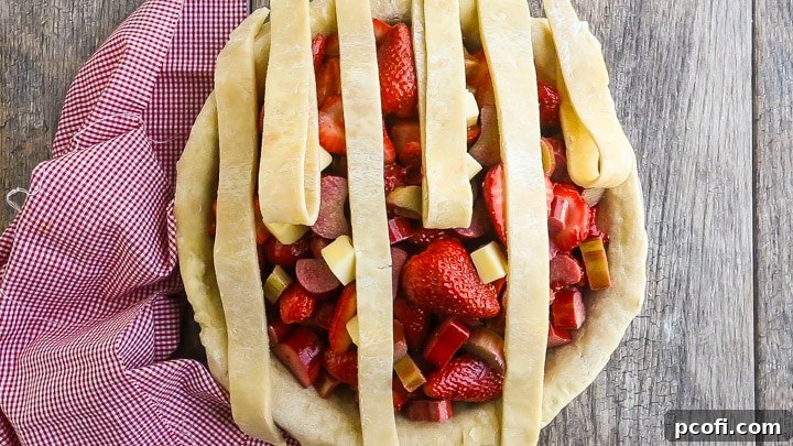 How to Make Lattice Pie Crust Step-by-Step: Folding Up Every Other Strip.