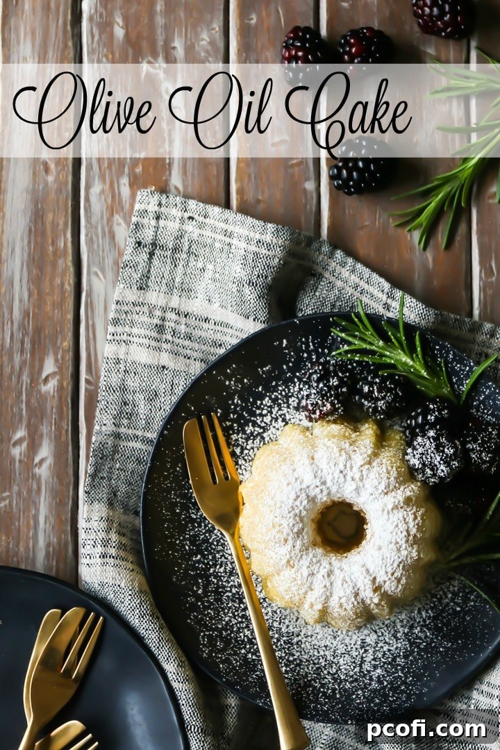 A beautifully baked almond olive oil cake, lightly dusted with powdered sugar for a touch of elegance.