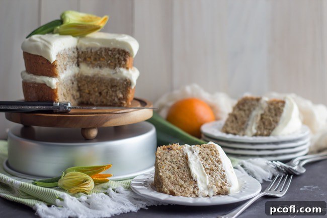Slice of Zucchini Cake with Cream Cheese Frosting, showing layers
