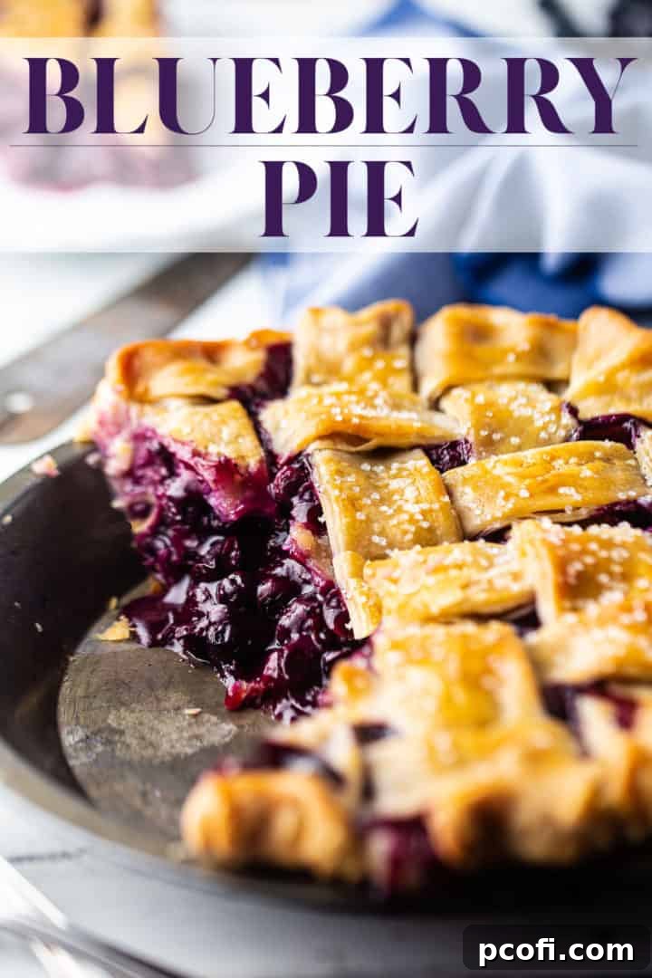 Blueberry pie recipe, prepared and baked with a lattice top crust, with a text overlay that reads "Blueberry Pie."