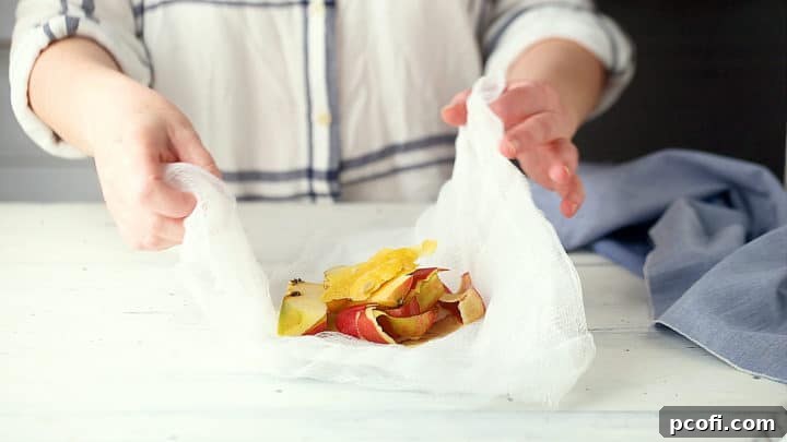 Tying apple cores & lemon peels in cheesecloth.