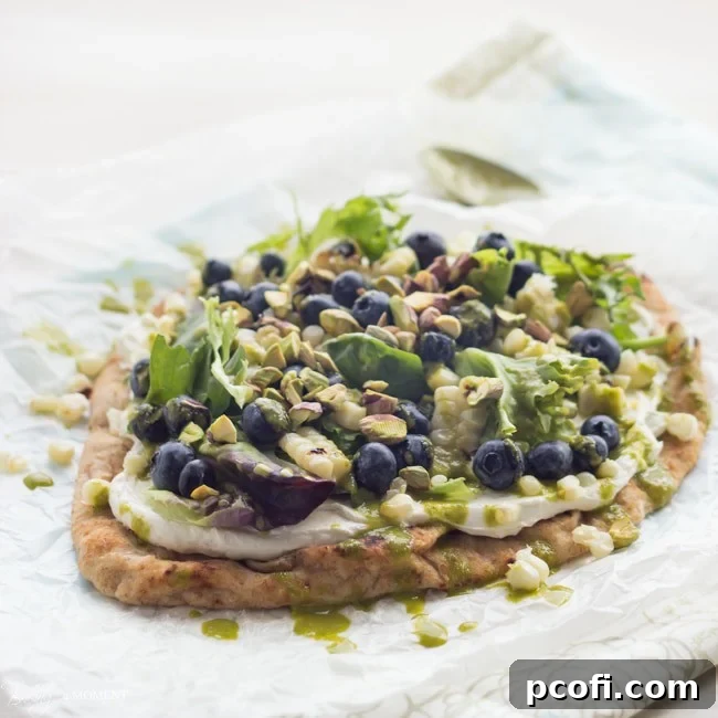 Grilled Corn & Blueberry Flatbread with Whipped Goat Cheese & Basil Vinaigrette, a perfect summer meal idea.
