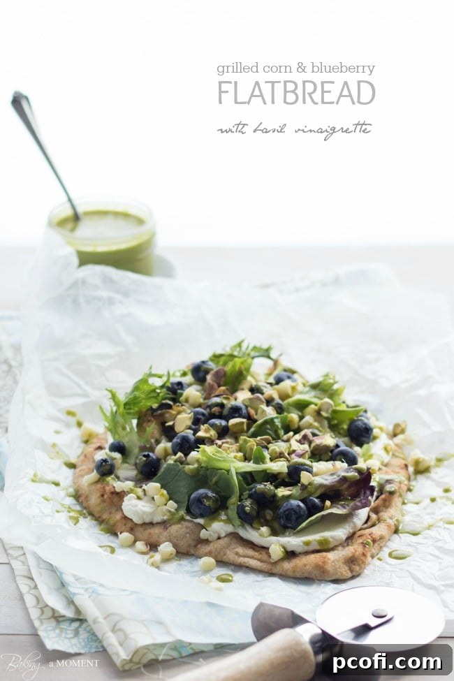 Close-up of the beautiful Grilled Corn & Blueberry Flatbread, showcasing fresh ingredients.