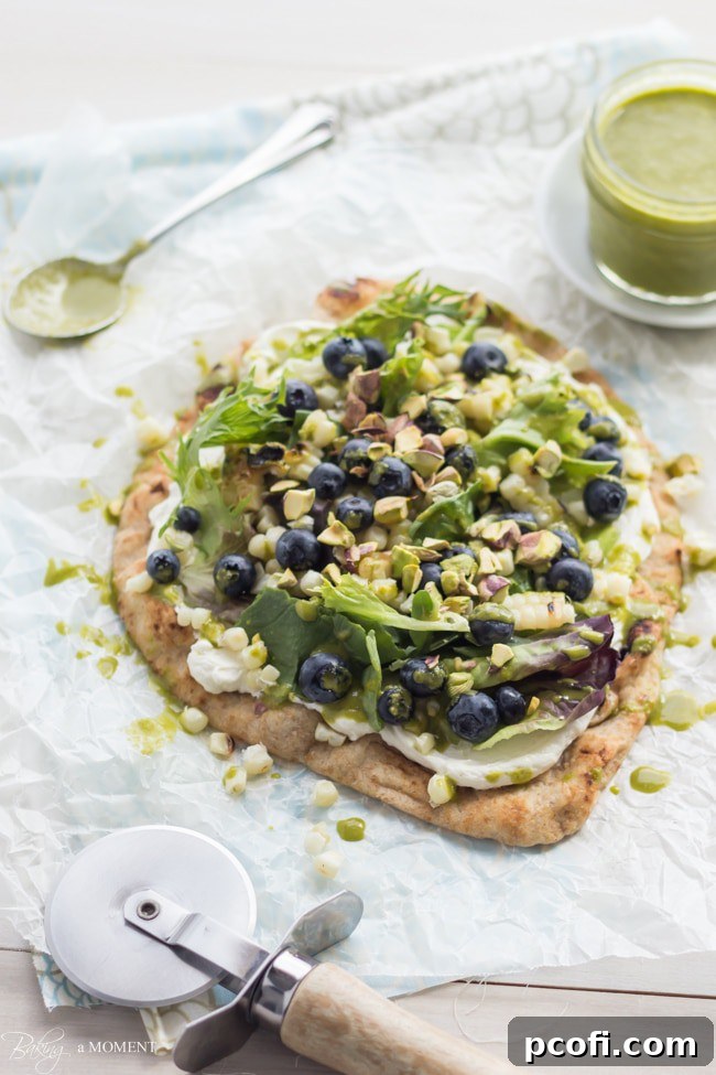 A beautifully composed Grilled Corn & Blueberry Flatbread, ready to be served.