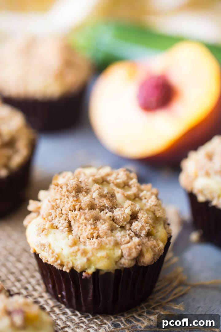 Fresh ingredients for making Peach Zucchini Streusel Muffins including flour, butter, peaches, and zucchini.