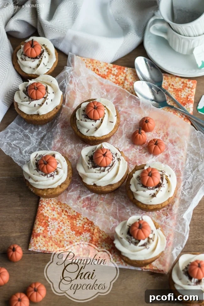 Close-up of perfectly baked Pumpkin Chai Cupcakes with intricate frosting detail, showcasing their delightful texture.
