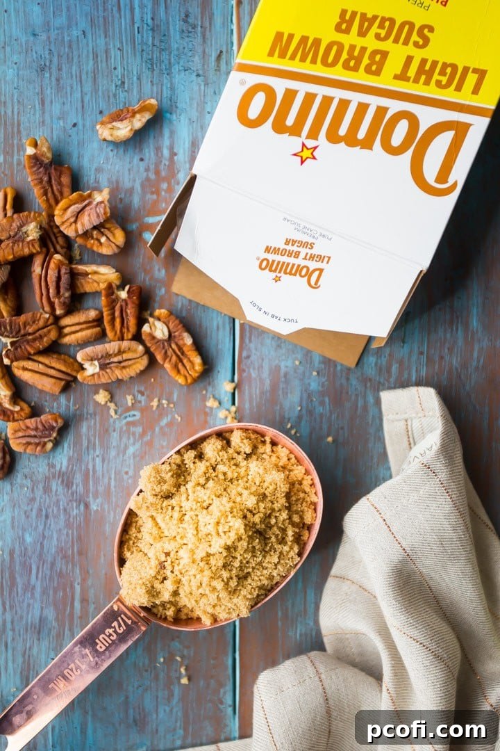 Homemade Brown Sugar Pecan Tassies ready to be enjoyed, emphasizing the rich brown sugar flavor.