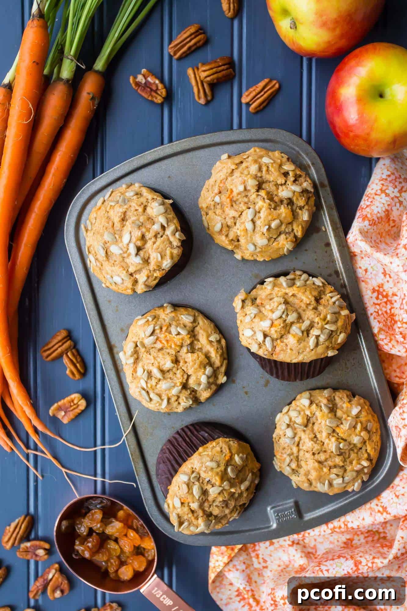 Healthy Morning Glory Muffins Recipe with shredded carrots and apples on a cooling rack