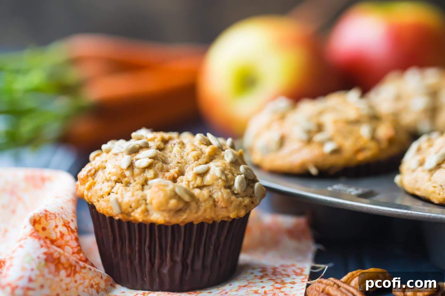 Collection of fresh ingredients for Original Morning Glory Muffins Recipe including flour, sugar, eggs, fruit, and nuts