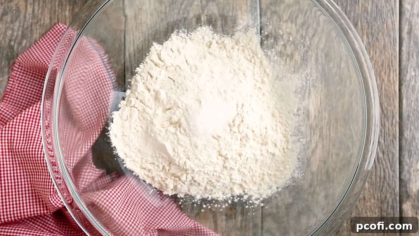 Flour and salt in a large glass mixing bowl.