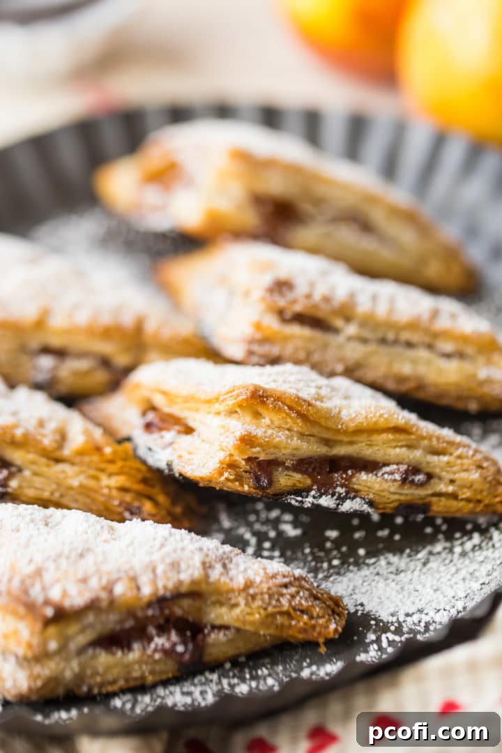Flaky Apple Turnovers with Powdered Sugar Garnish