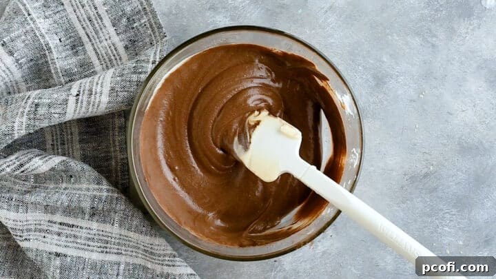 Half of the cake batter expertly flavored with cocoa, transformed into rich chocolate batter.