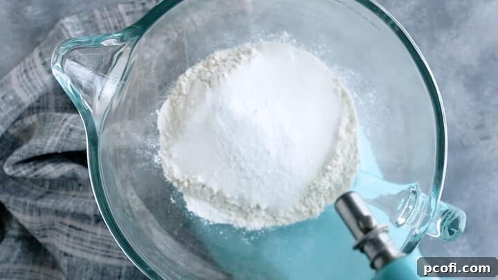 Dry ingredients for marble cake combined in a large mixing bowl, perfectly mixed and ready for the next step.