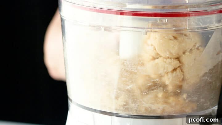 Tart dough gathering itself into a ball in the food processor, perfect consistency.