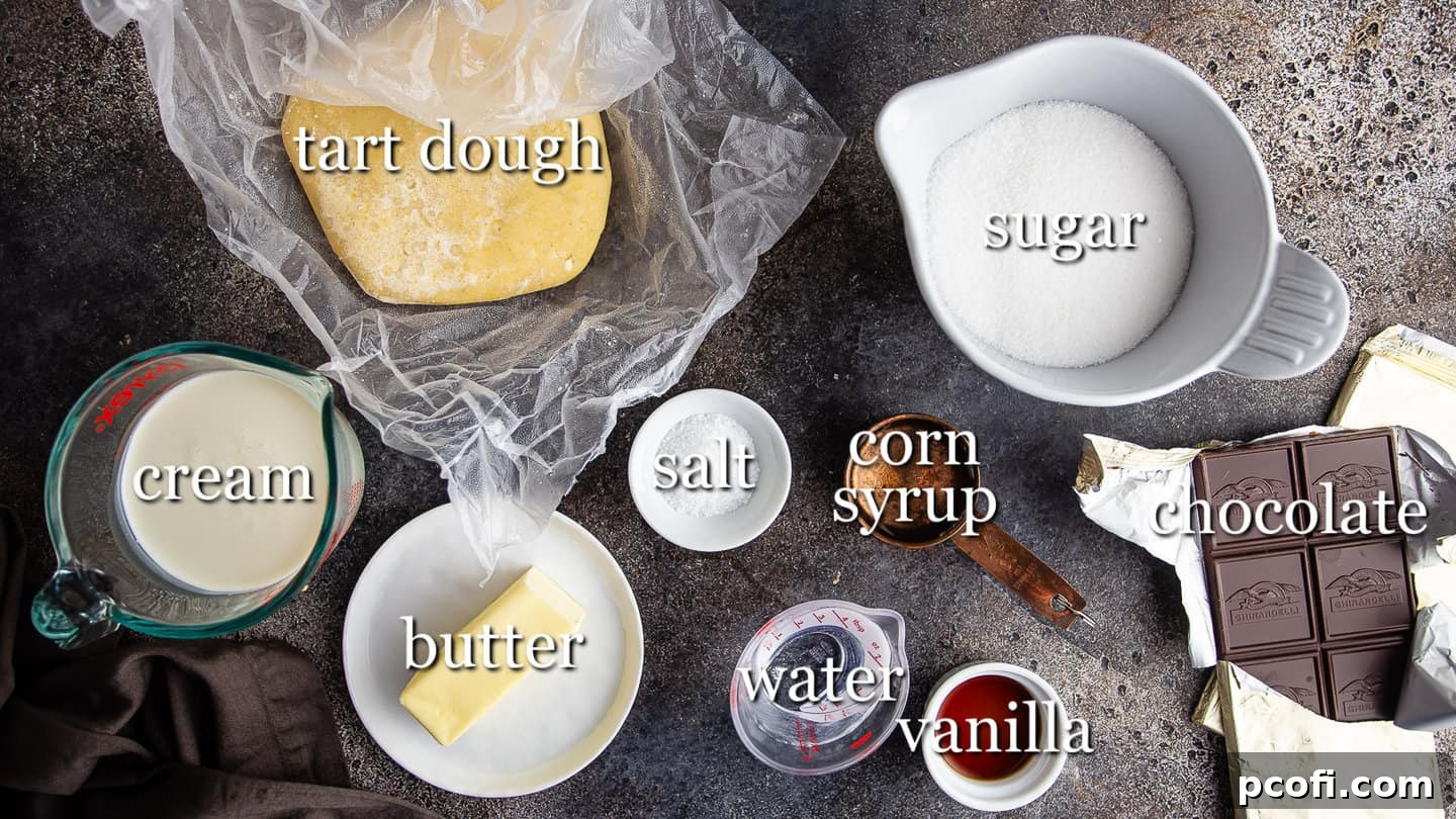 Organized display of ingredients for making salted caramel chocolate tart, clearly labeled for easy identification.