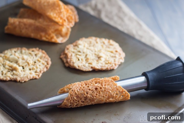 Such a fun Fall treat! Pumpkin Cannoli with a creamy, spiced filling & a nutty almond brittle shell.