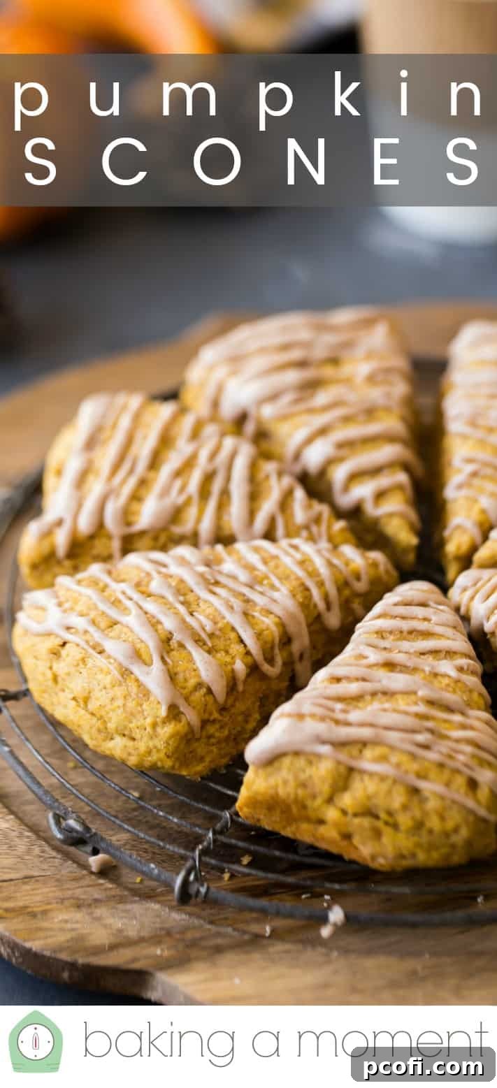 Close-up image of moist pumpkin scones on a wire cooling rack, with a text overlay above reading "Pumpkin Scones."