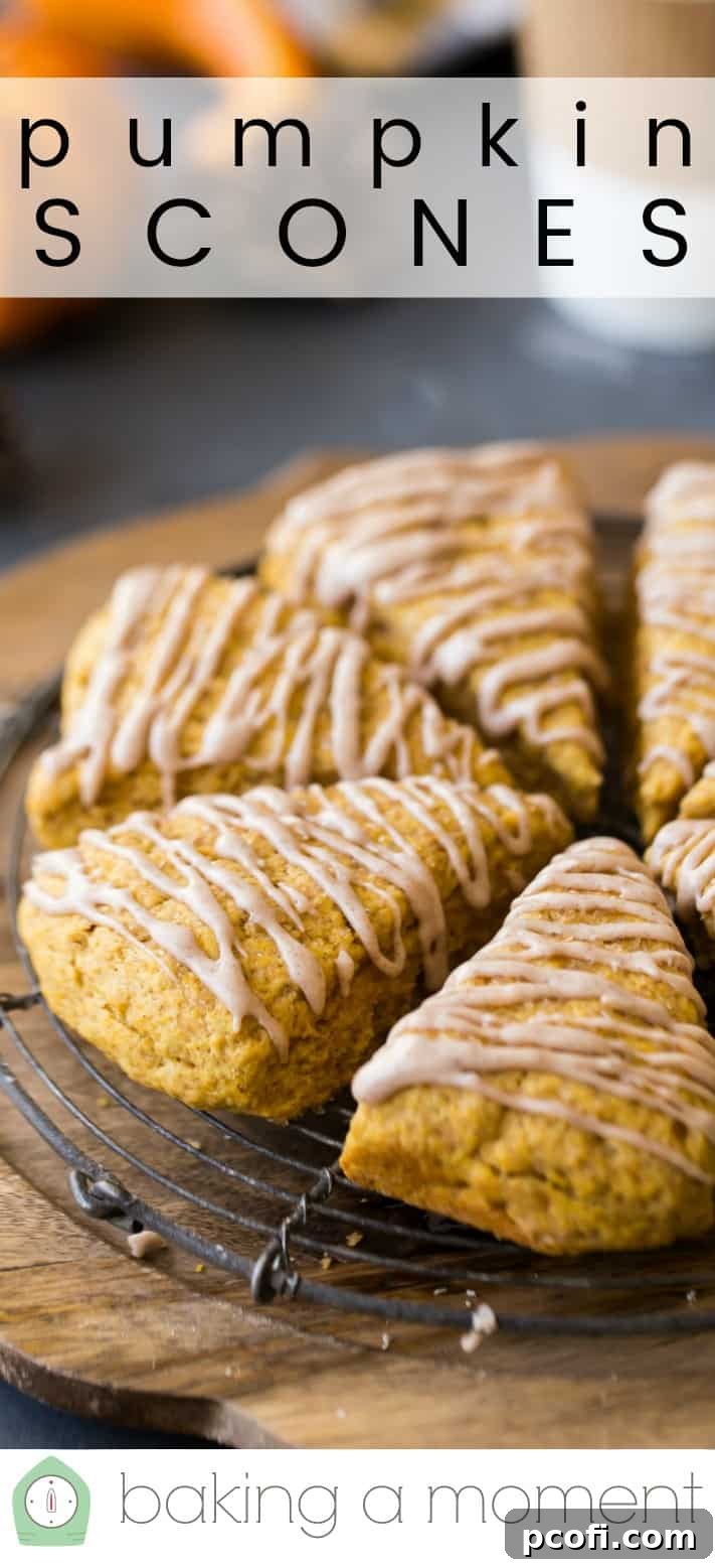 Close-up image of moist pumpkin scones on a wire cooling rack, with a text overlay above reading "Pumpkin Scones."