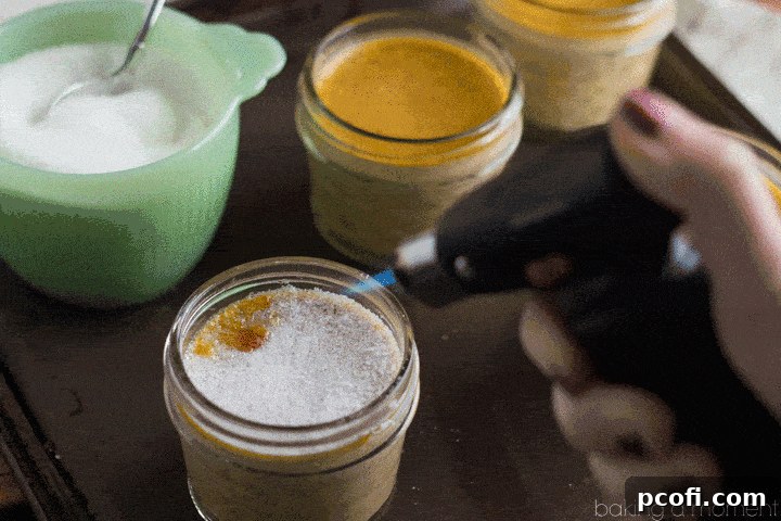 Delicious Pumpkin Creme Brulee ready to be served, adorned with a sprig of fresh mint for an elegant touch.