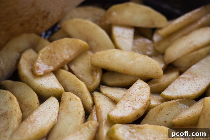 Preparing the apples for the Apple Walnut Bread Pudding, a key step for a comforting Fall dessert.