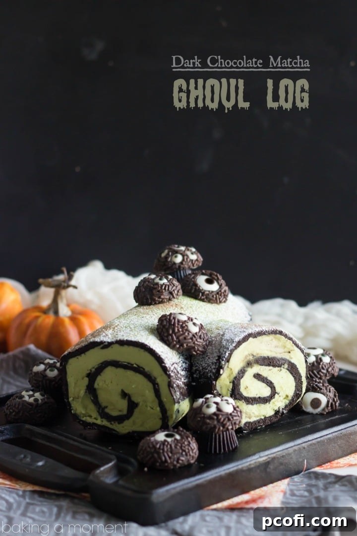 A close-up view of the Dark Chocolate Matcha Ghoul Log, showcasing its dark exterior, the vibrant green matcha buttercream filling, and the intricate texture of the cake.