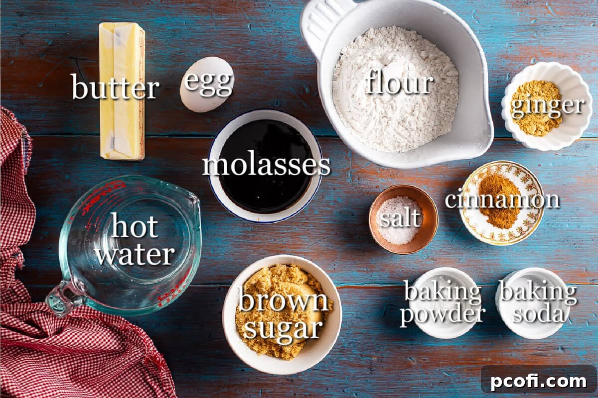A selection of gingerbread cake ingredients laid out in separate, neatly arranged containers, including flour, butter, molasses, brown sugar, and various spices, showcasing freshness and readiness for baking.
