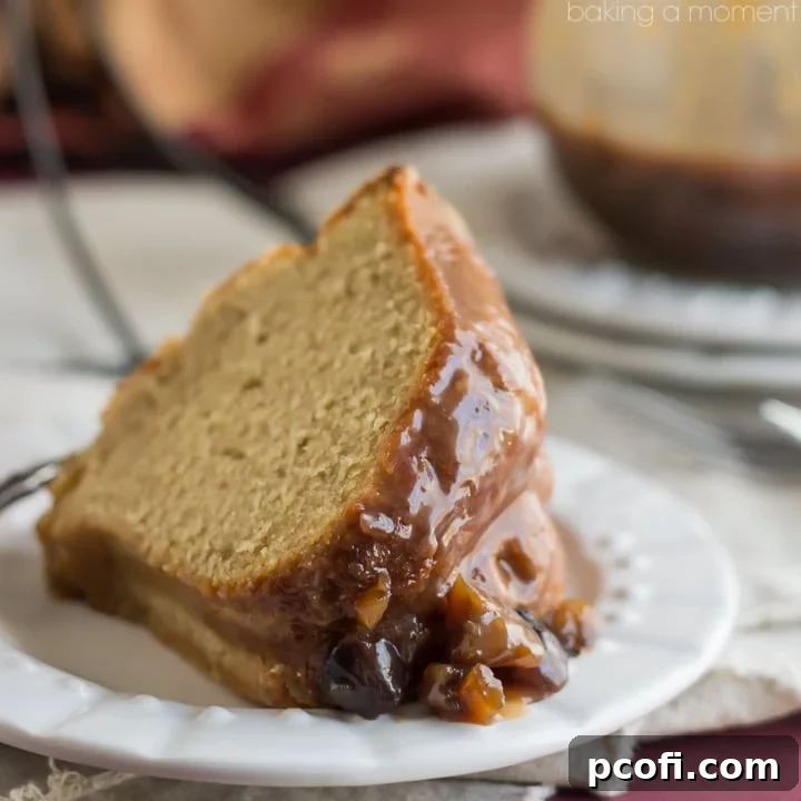 Rich, golden Chestnut Praline Coffee Bundt Cake, freshly baked and ready for holiday enjoyment, drizzled with sweet sauce.