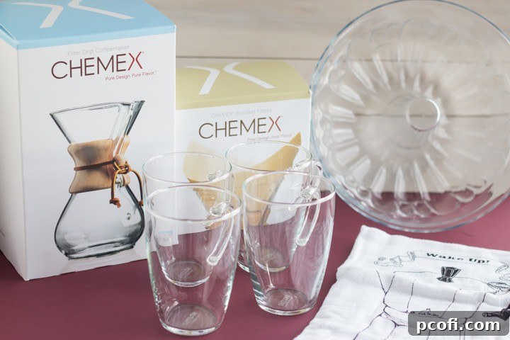 Mighty Nest Giveaway prize pack featuring a glass bundt pan, Chemex coffeemaker, tea towel, and glass mugs.