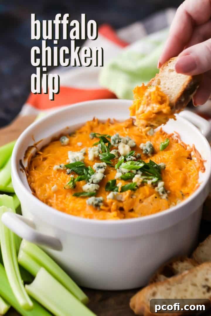 Easy Buffalo Chicken Dip Recipe served with celery sticks and baguette slices.