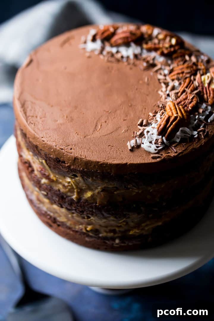 Moist German Chocolate Cake Slices: Closeup of delicious German Chocolate Cake slices, showing moist chocolate layers and thick coconut pecan filling. Perfect dessert display.