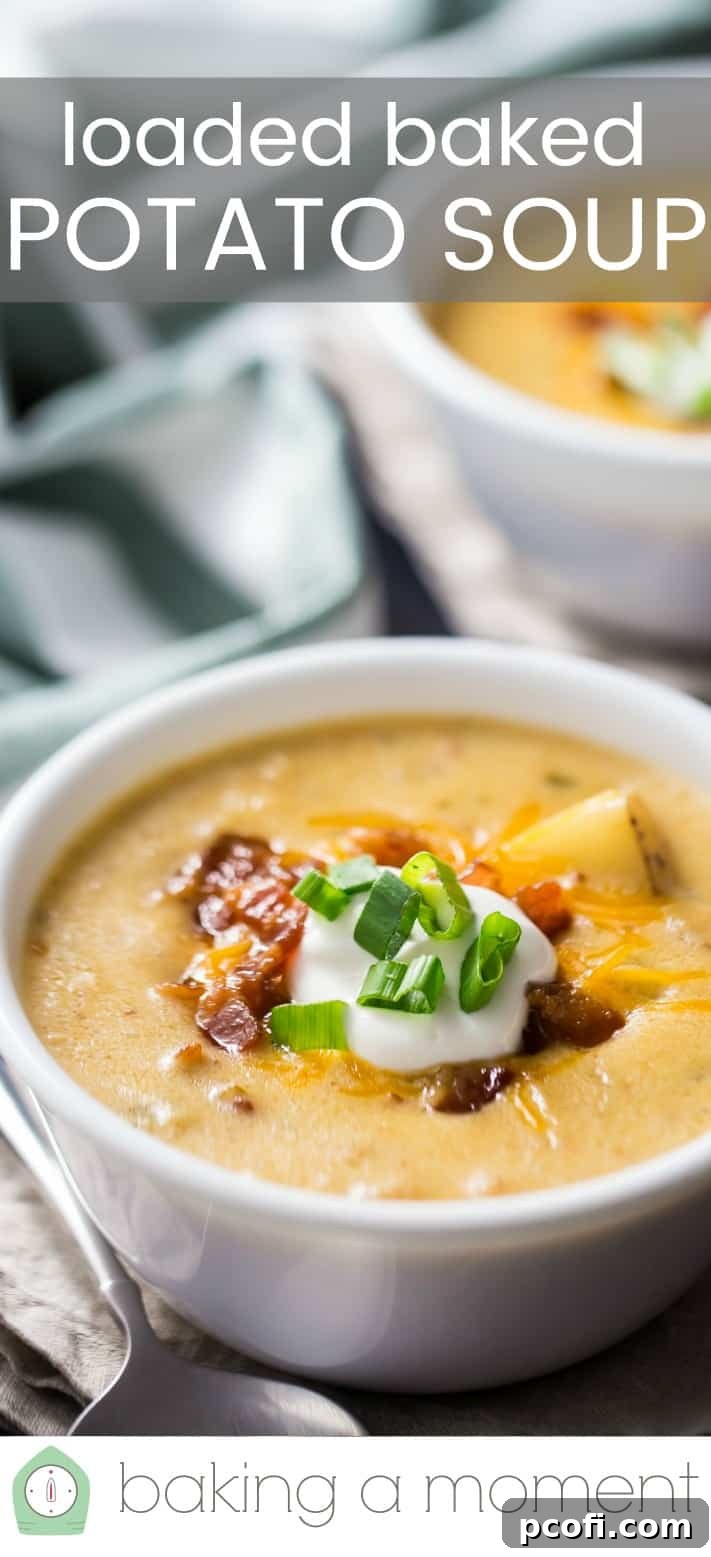 A spoon dipping into a bowl of homemade loaded baked potato soup, highlighting its thick and hearty texture.