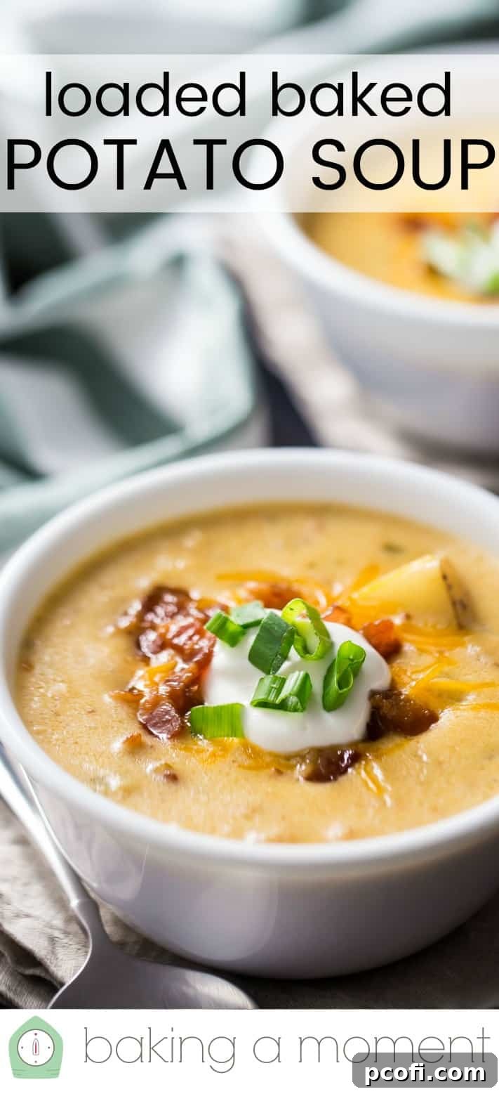 Overhead shot of a bowl of loaded baked potato soup, ready to be served, showcasing all its delicious toppings.