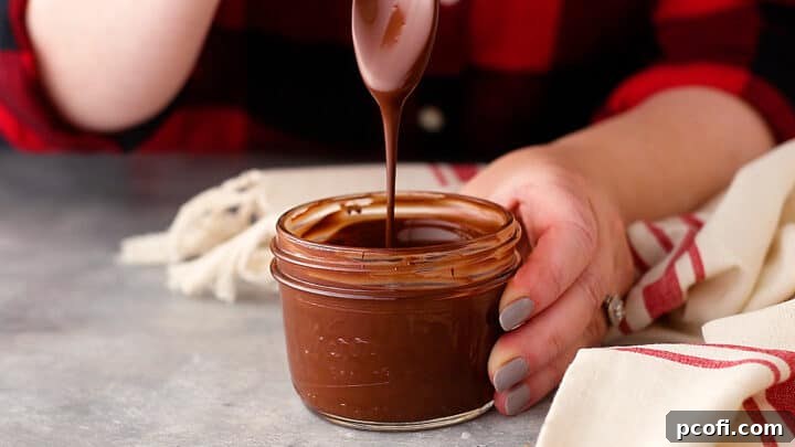 Stirring melted chocolate until it's completely smooth and luxurious.