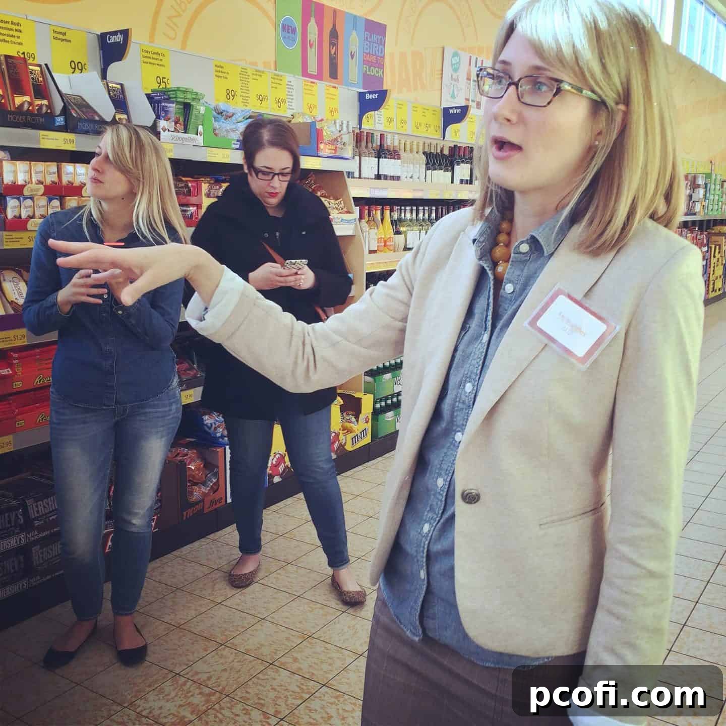 Participants engaging in a fun wine pairing challenge at the Aldi test kitchen, showcasing different food and wine combinations. A vibrant image from the #inthealdikitchen #aldiholiday event.