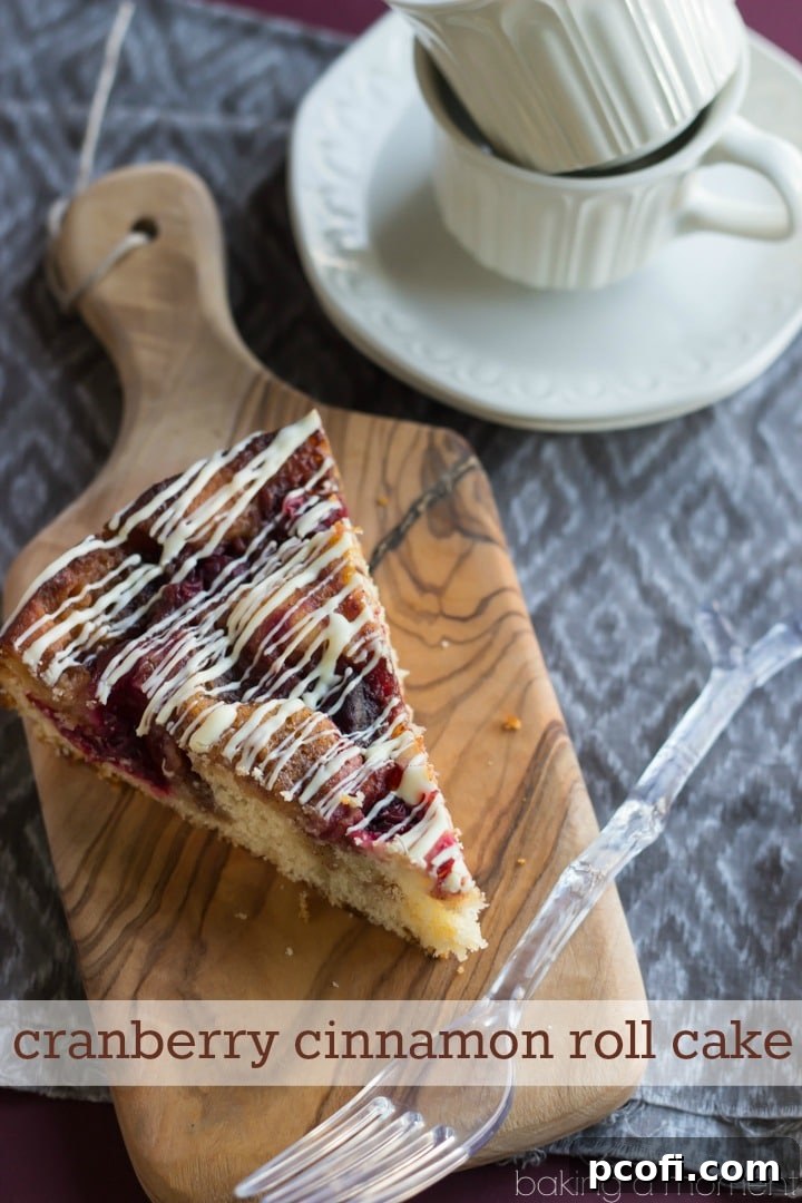 Close-up of the delicious Cranberry Cinnamon Coffee Cake with white chocolate drizzle, highlighting its gooey texture and festive cranberry swirls. A perfect holiday breakfast treat, made easy with Aldi ingredients.