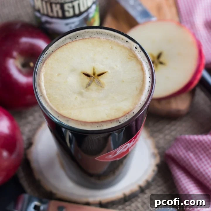 The Velvet Apple Cocktail, a perfect simple drink for a crisp day, garnished with a fresh apple slice