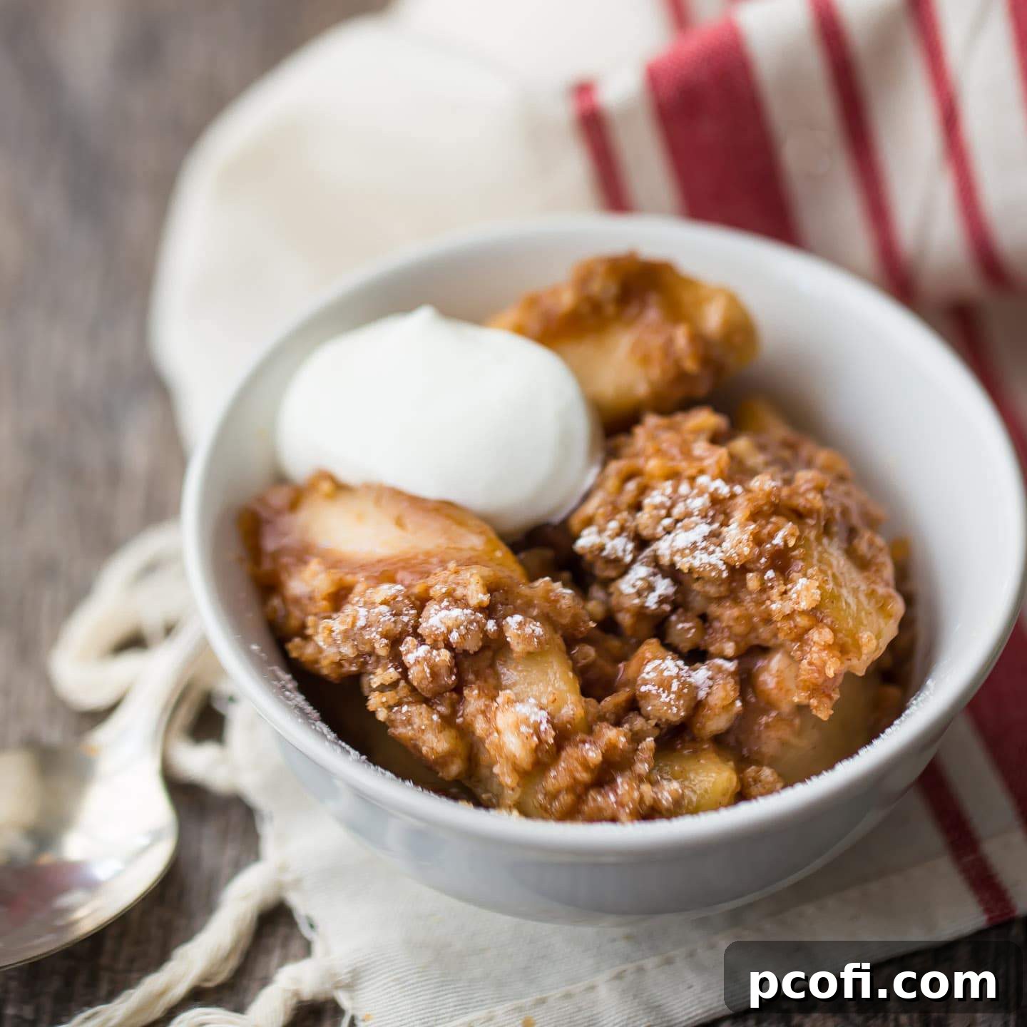A serving of comforting Easy Apple Crisp, with a golden, crunchy topping and warm spiced apples beneath.
