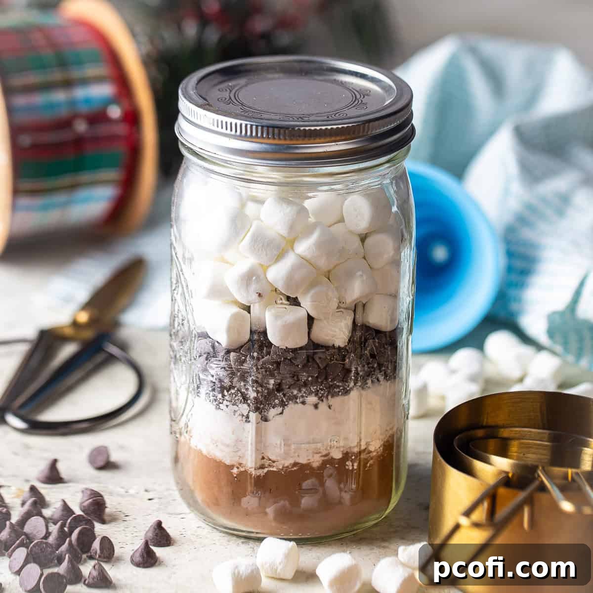 Homemade hot cocoa mix in a mason jar, perfect for a cozy holiday drink or gift.