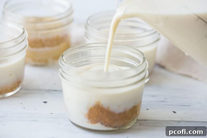 Pouring milk mixture over tres leches cakes.