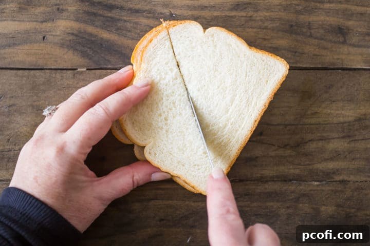 Cutting bread for overnight French toast casserole.