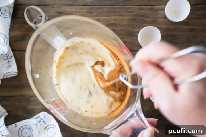 Making custard for French toast casserole.