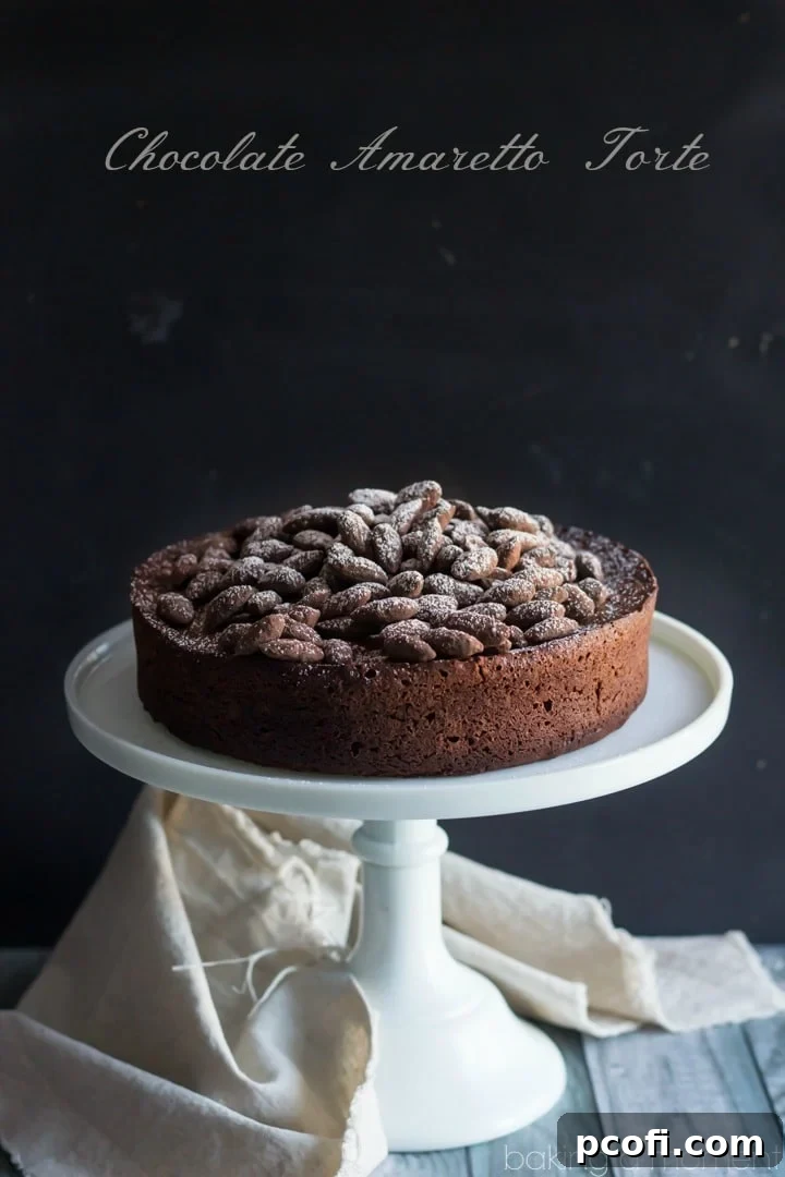 Decadent Chocolate Amaretto Torte, a rich dessert that's part cake, part soufflé, with a hint of almond. #dessertideas #holidaybaking #chocolatealmond