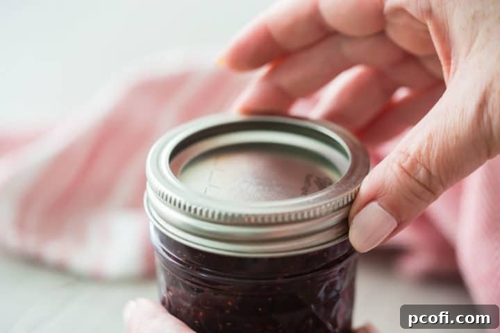 Putting lids on canning jars.