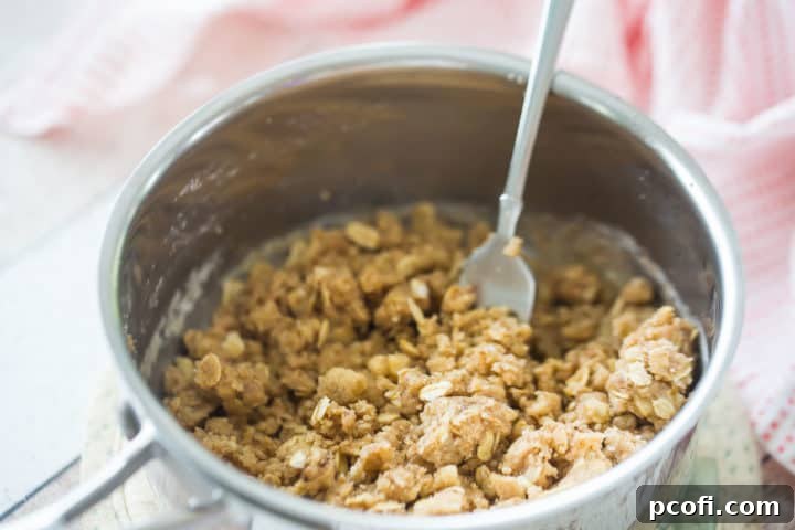 Crumb topping in a small pot with a fork.