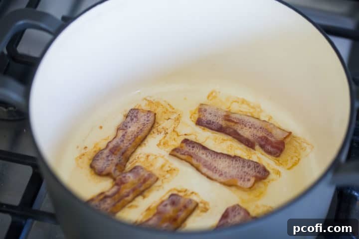 Bacon cooking in a large pot.