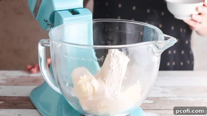 Cream cheese, sugar, and cornstarch in a large mixing bowl.