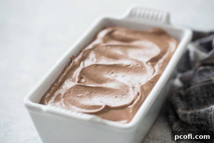 Homemade chocolate ice cream in a white ceramic loaf pan.