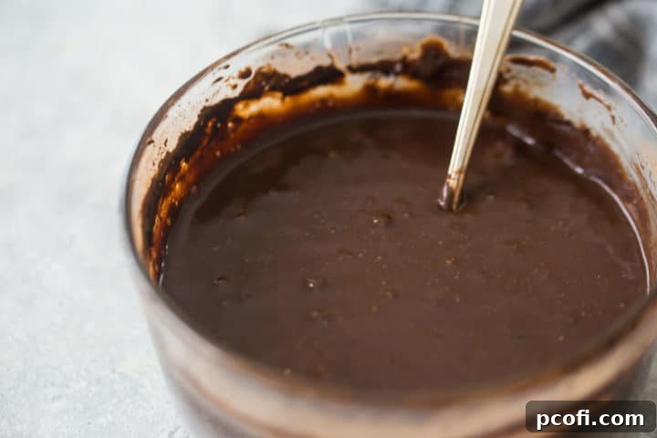 Homemade chocolate ice cream base in a glass bowl.