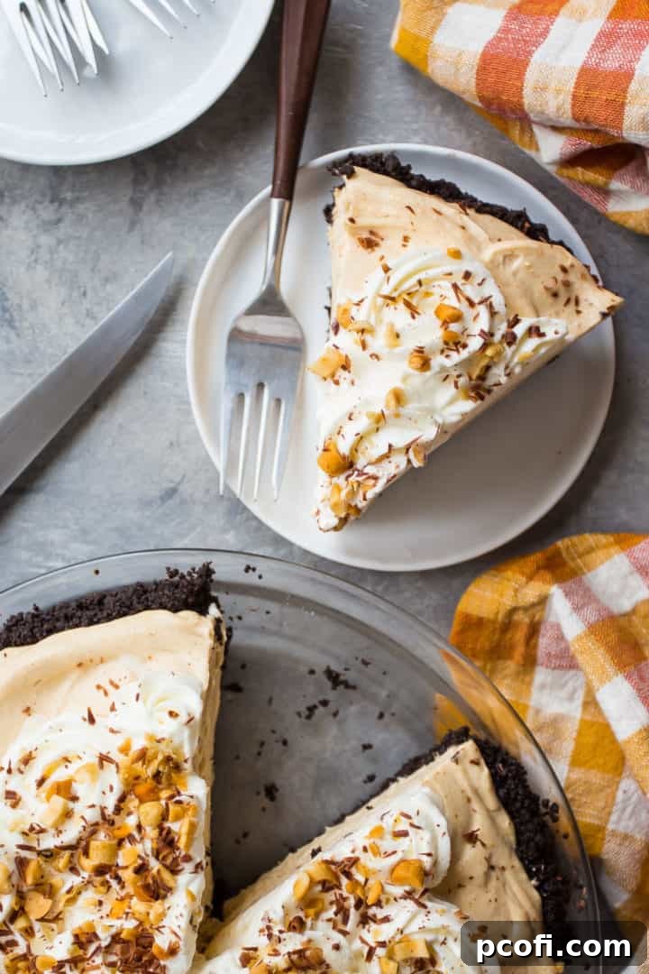 Overhead image of a slice of easy peanut butter pie with an orange checked cloth.
